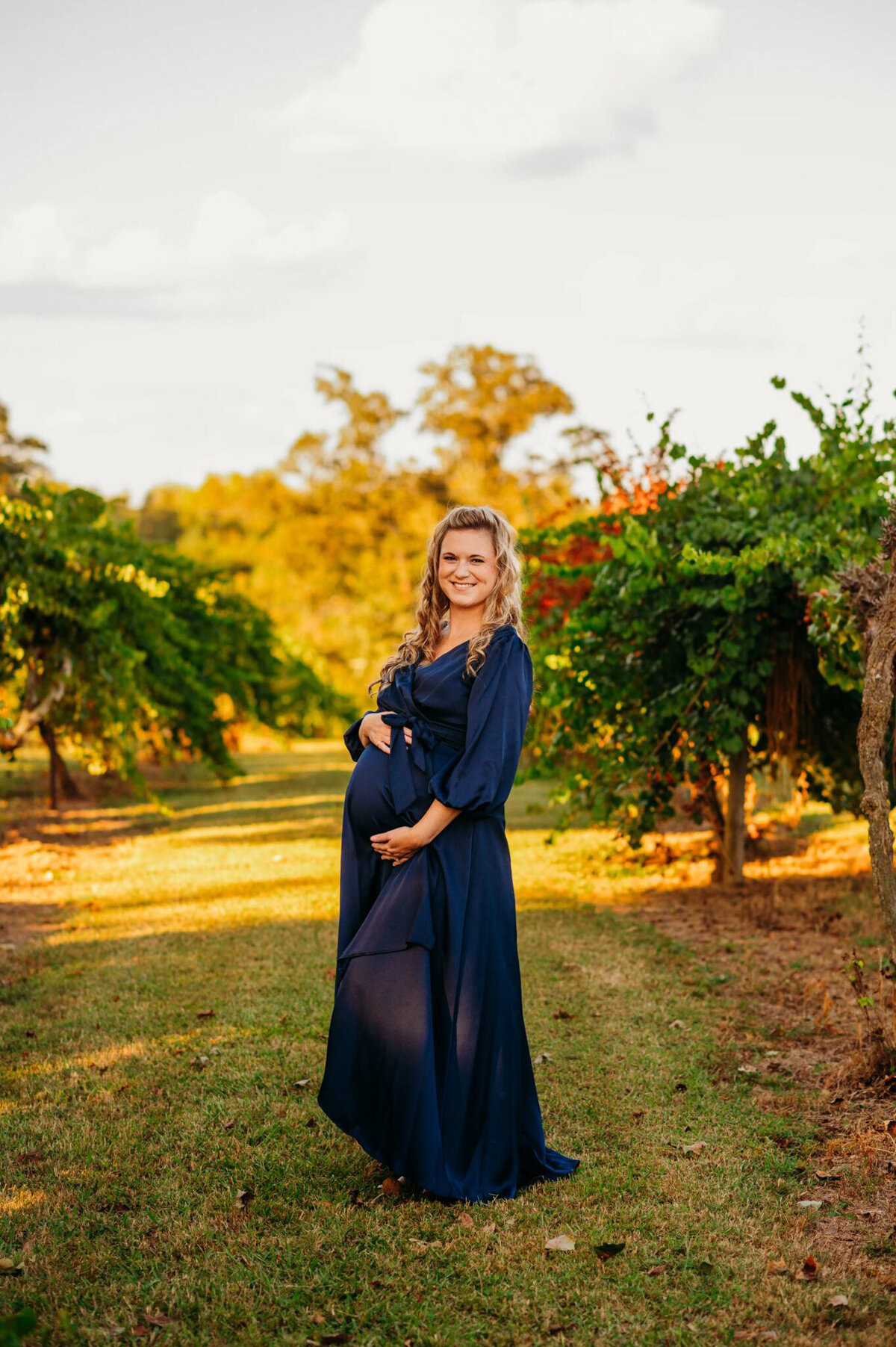 photo of pregnant woman at a vineyard
