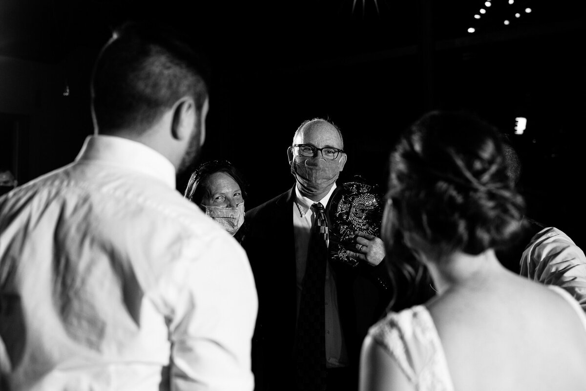 Grandparents give advice to the newlyweds after the anniversary dance