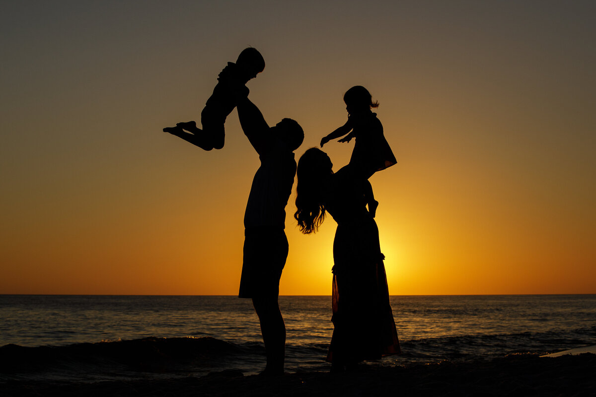 silhouette of family on 30a beach