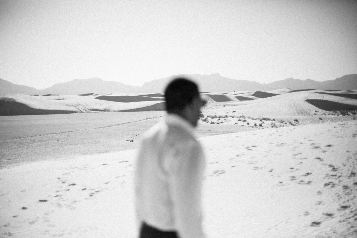 Man out of focus with sand in the background Mo davis photography