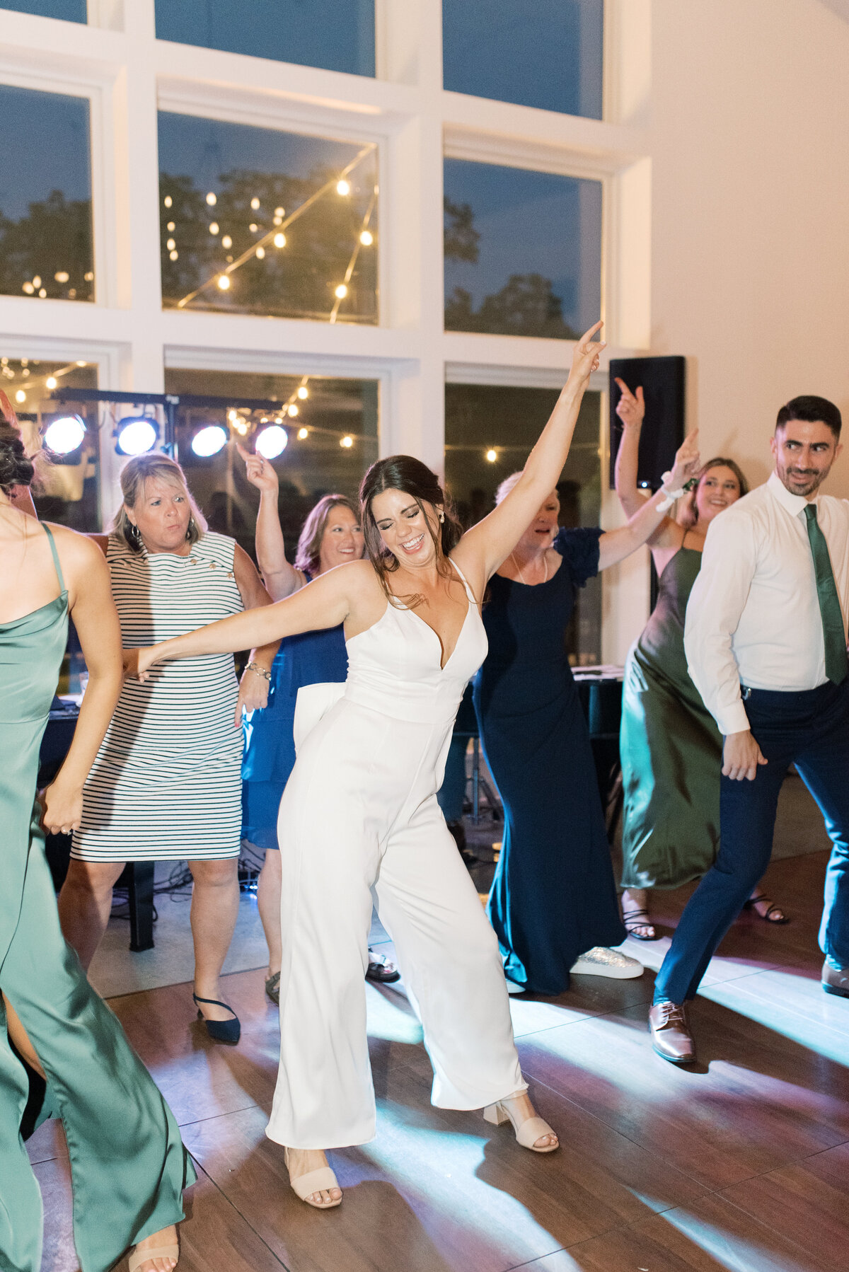 bride and wedding party dancing