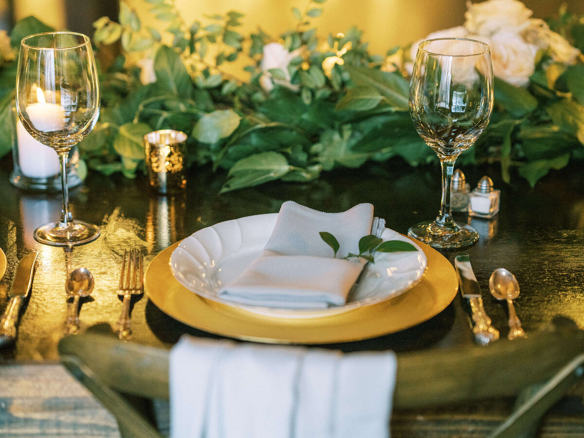 Elegant place setting at rustic wedding in North Texas