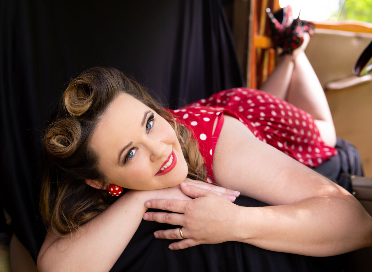goddess studio boudoir woman pinup seat of old ford truck polka dots vintage jumper pinup hair
