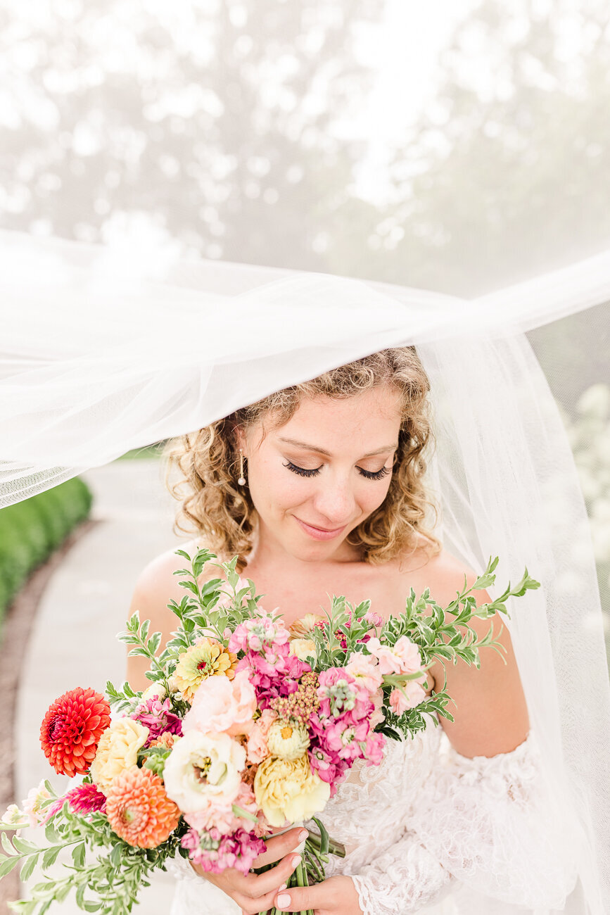 bride looking at her flowers