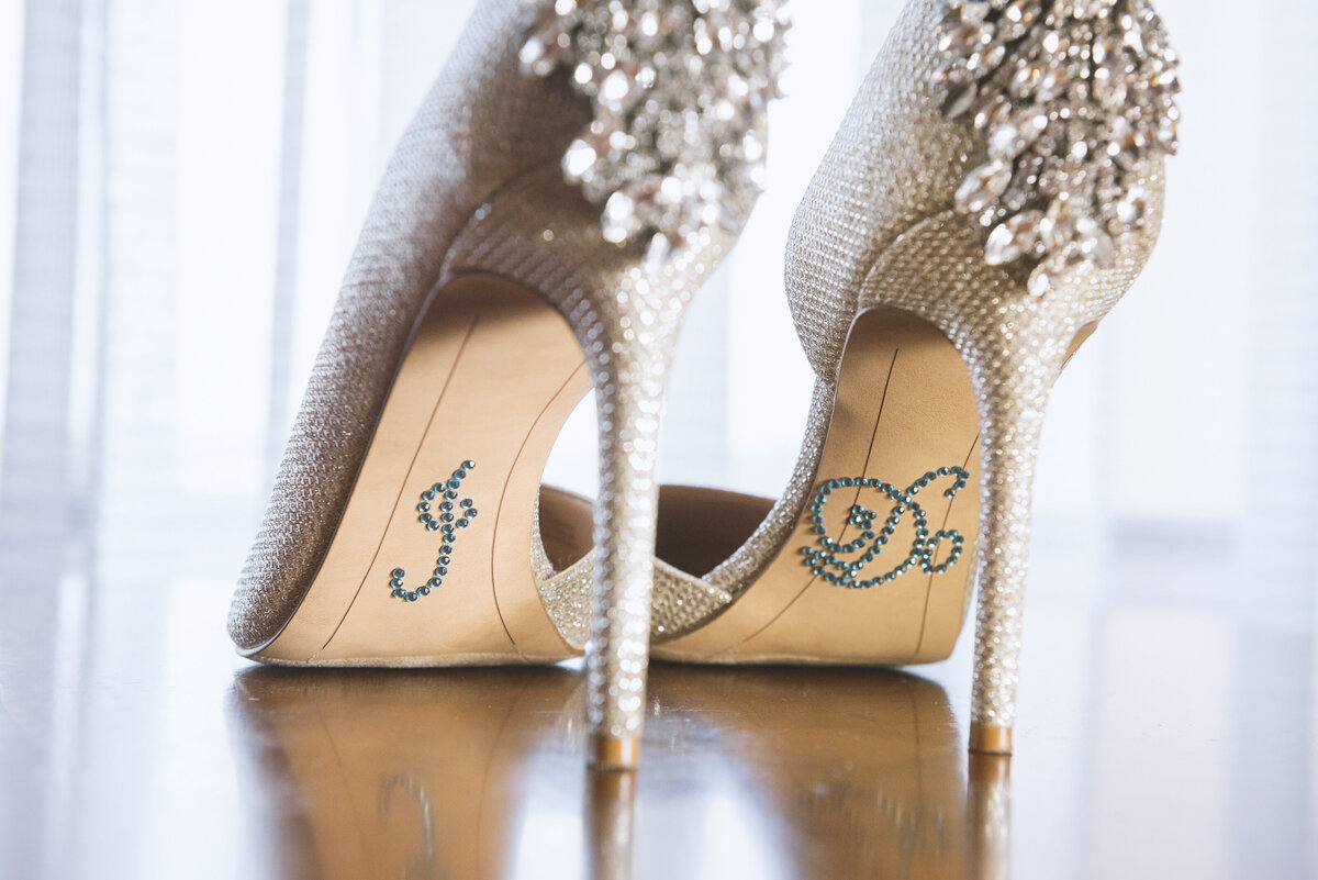 Wedding high heels with written letters I do on bottom.