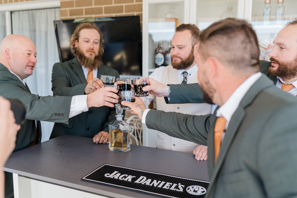 Grooms having a drink on his wedding day