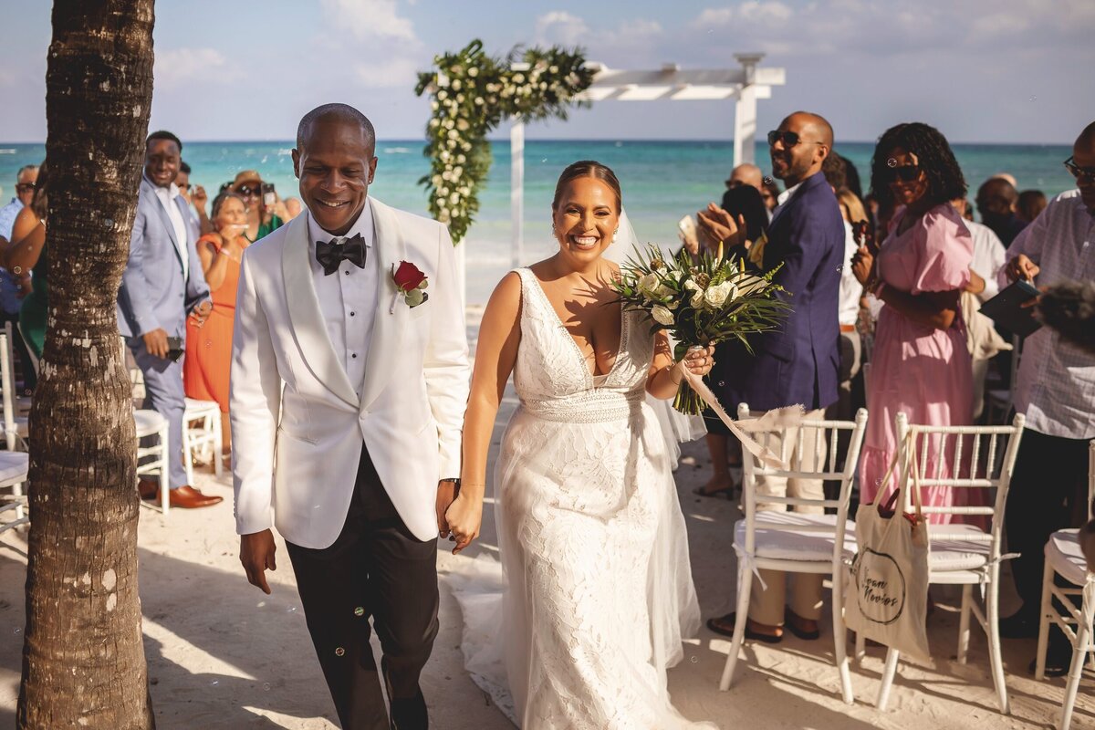 Bride and groom celebrate after wedding ceremony at Grand Palladium Colonial Resort, Riviera Maya