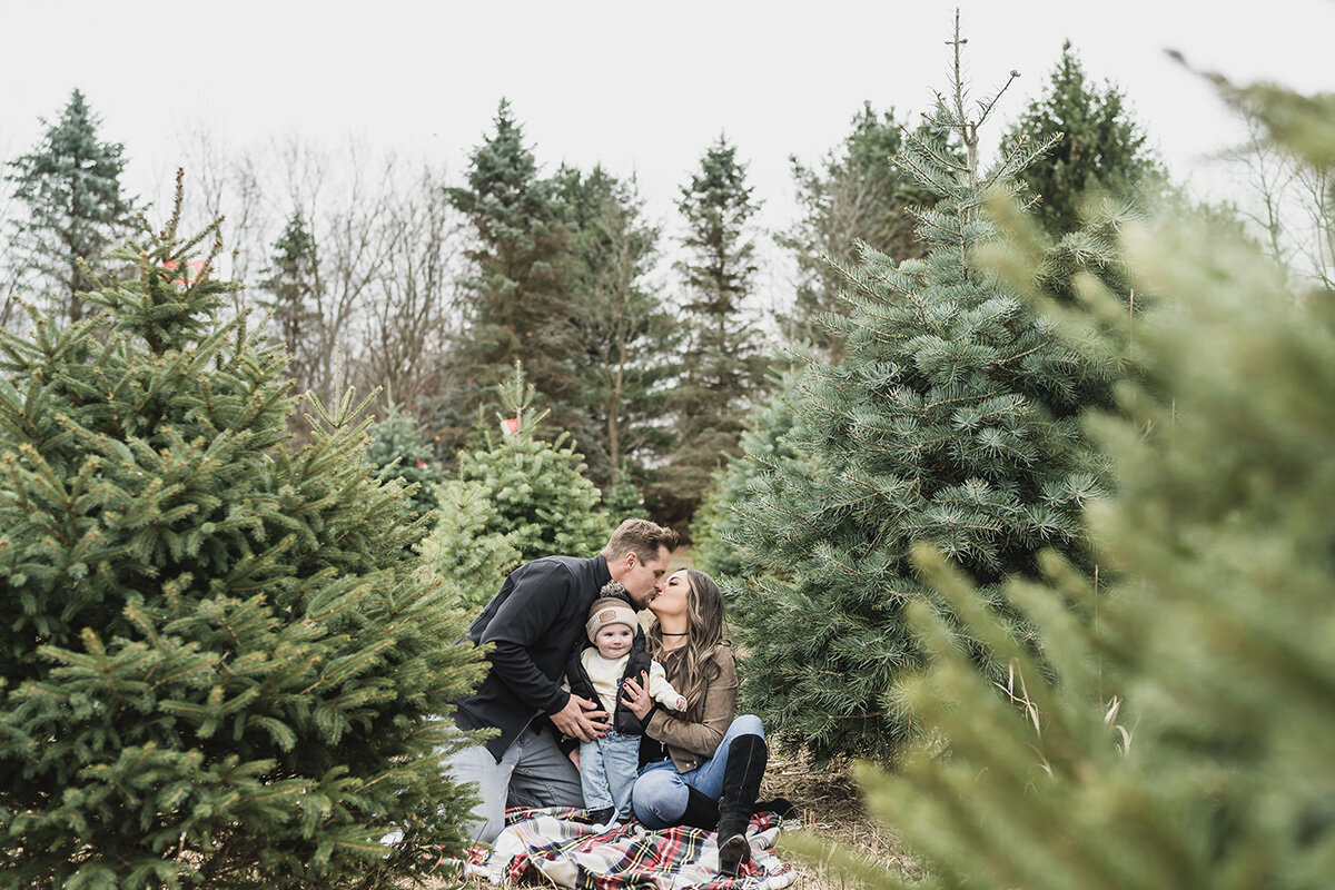 Family Pictures at a Christmas Tree Farm in Leonard Michigan provided by Kari Dawson top rated Michigan family photographer60