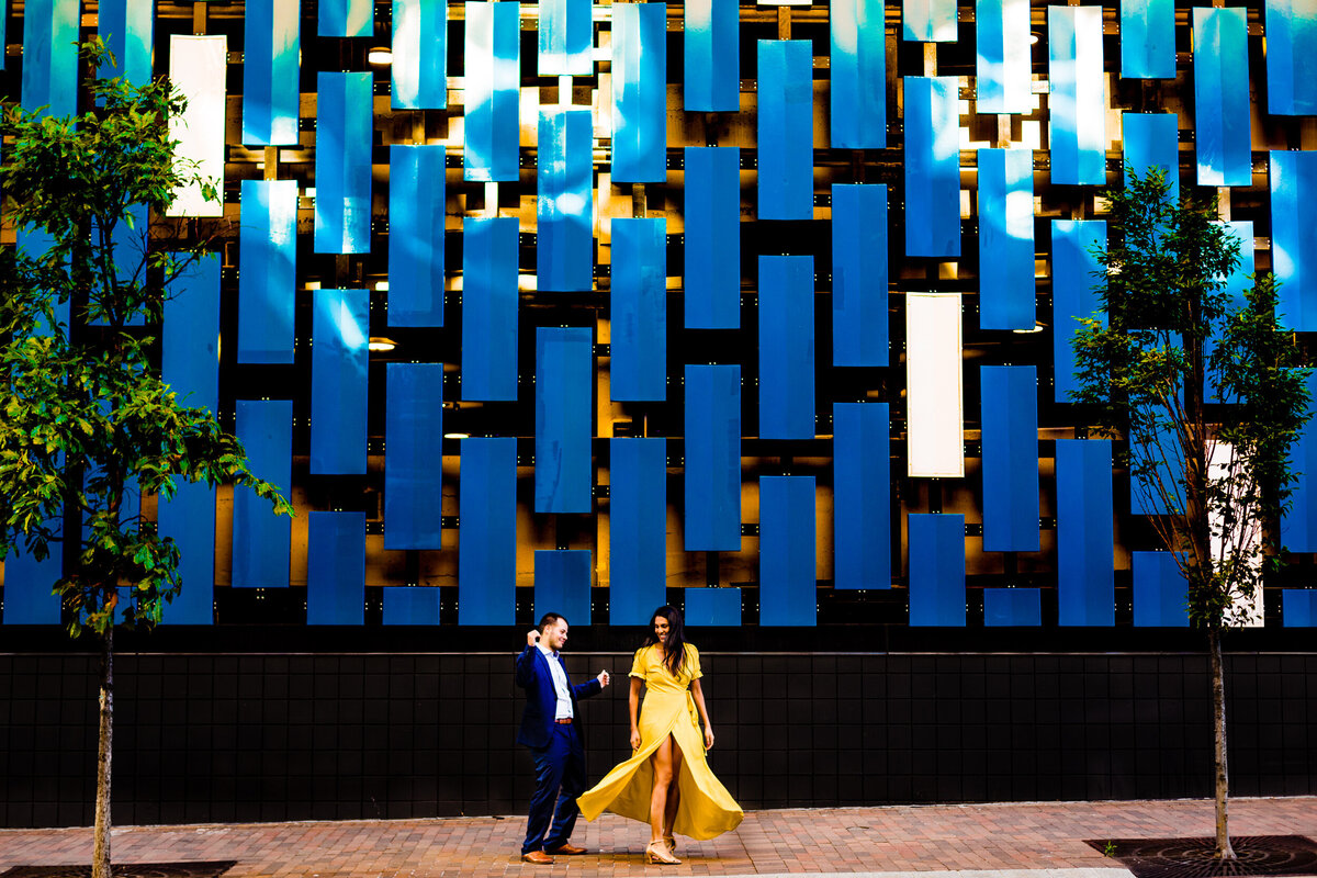 Couple dances in the street of downtown Pittsburgh During their engagement  photos. Photo By Adore Wedding Photography, Wedding Photographers in Toledo Ohio