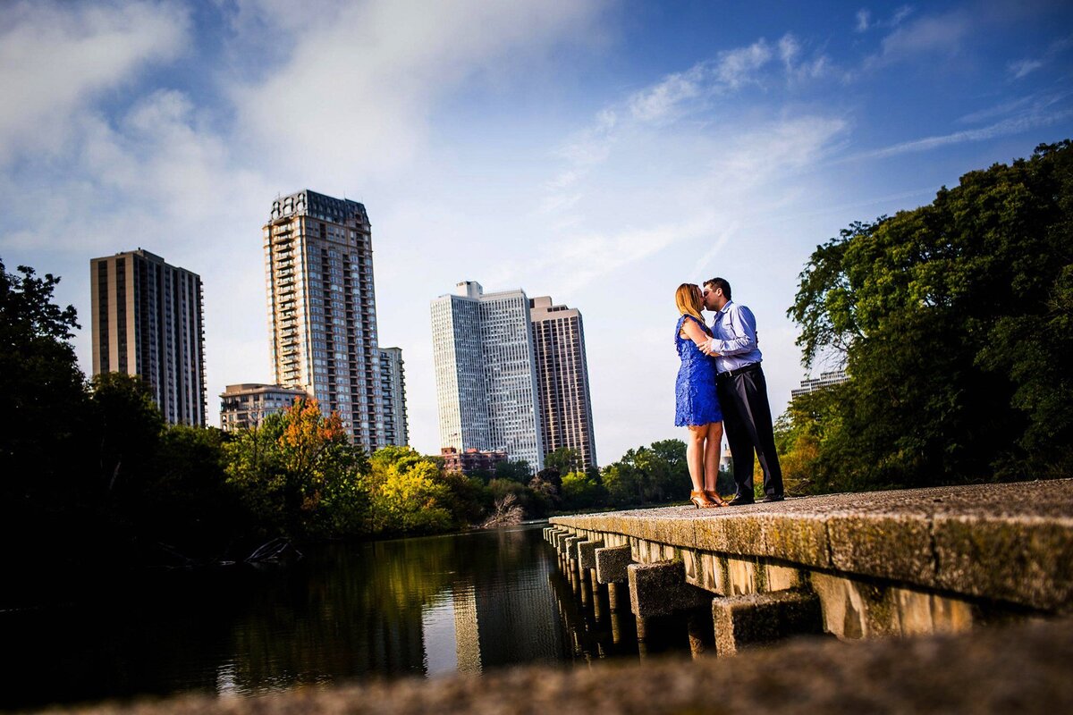 A couple shares a kiss during a Lincoln Park engagement session.