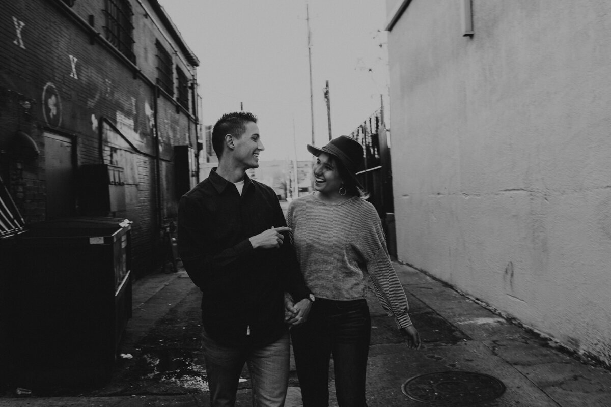 couple walking down an alley downtown Albuquerque