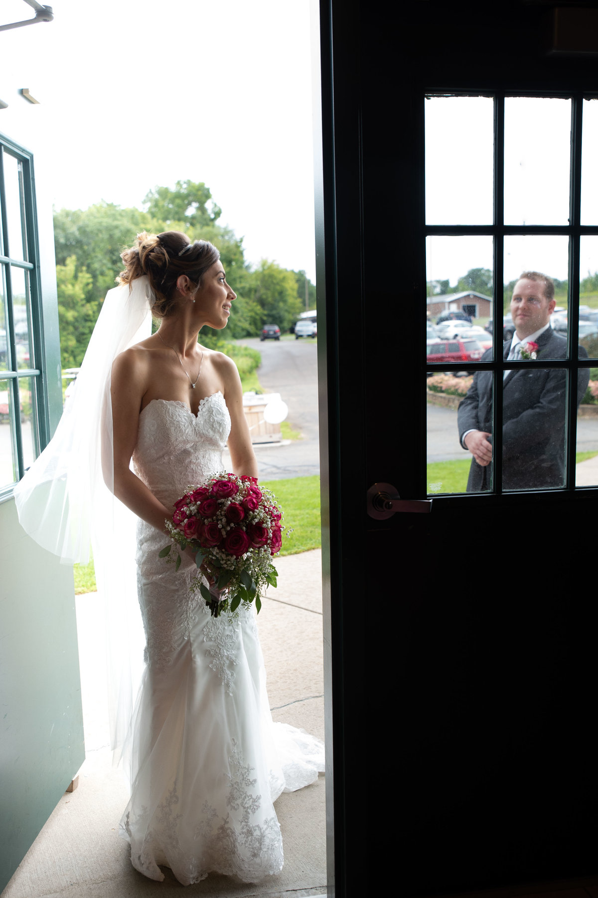 couple exchange look in doorway frame
