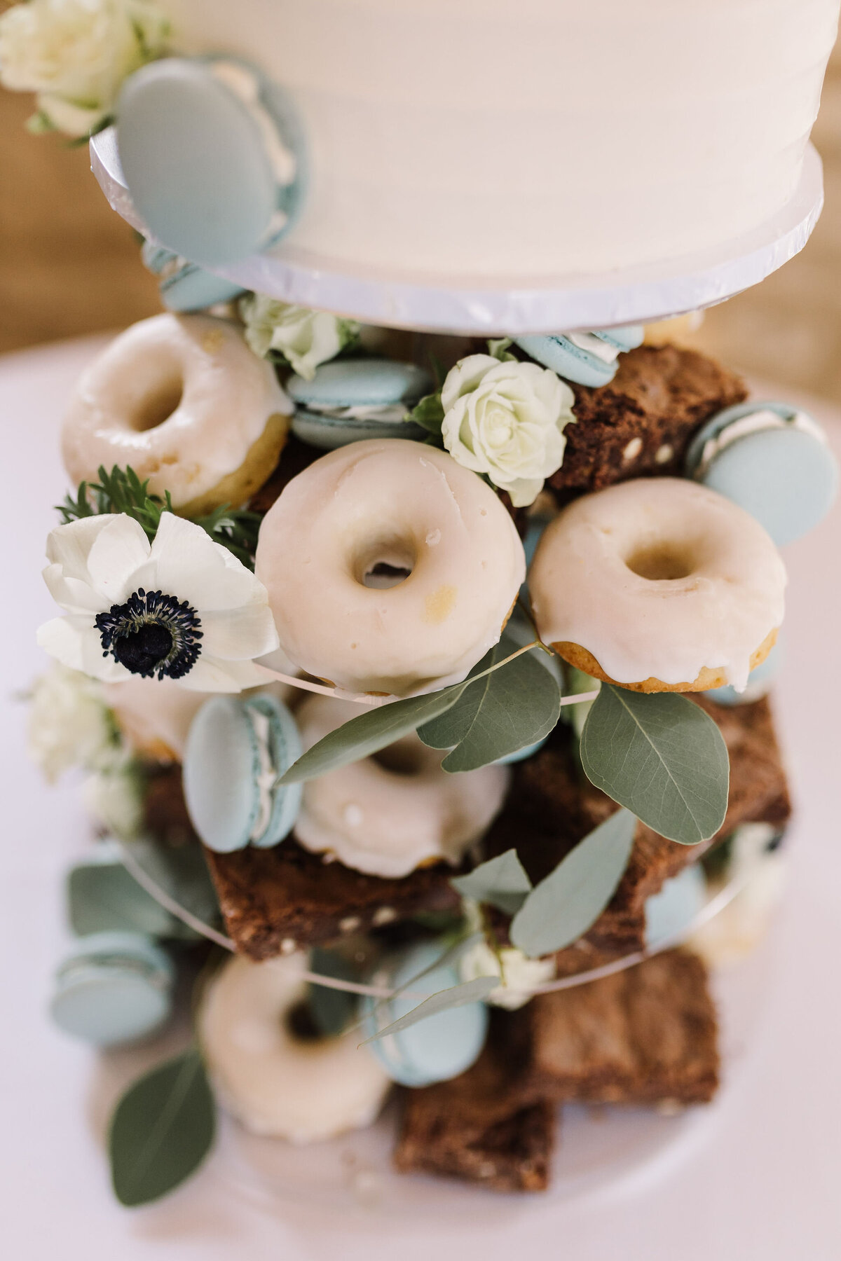 Dessert tower for wedding with brownies macarons doughnuts