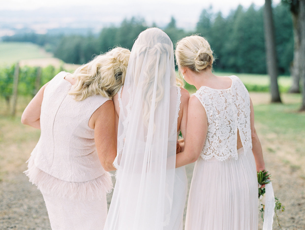 sweet photo of a bride with her mom and sister