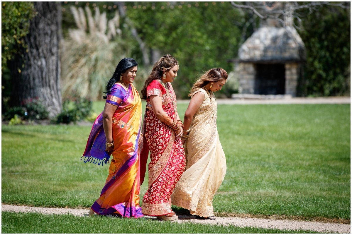 Austin wedding photographer pecan springs ranch wedding photographer bride walking to alter Indian wedding