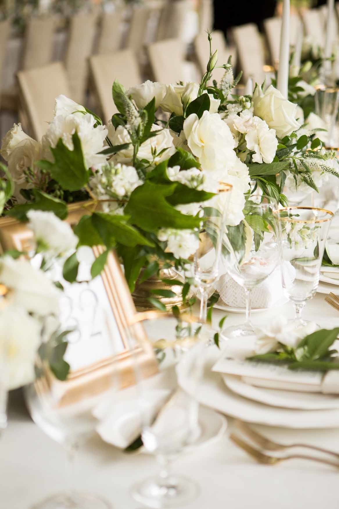 Long white table with low centerpieces