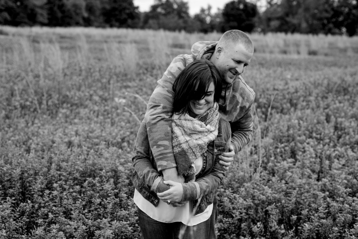 engaged couple in open field at bayone t farm