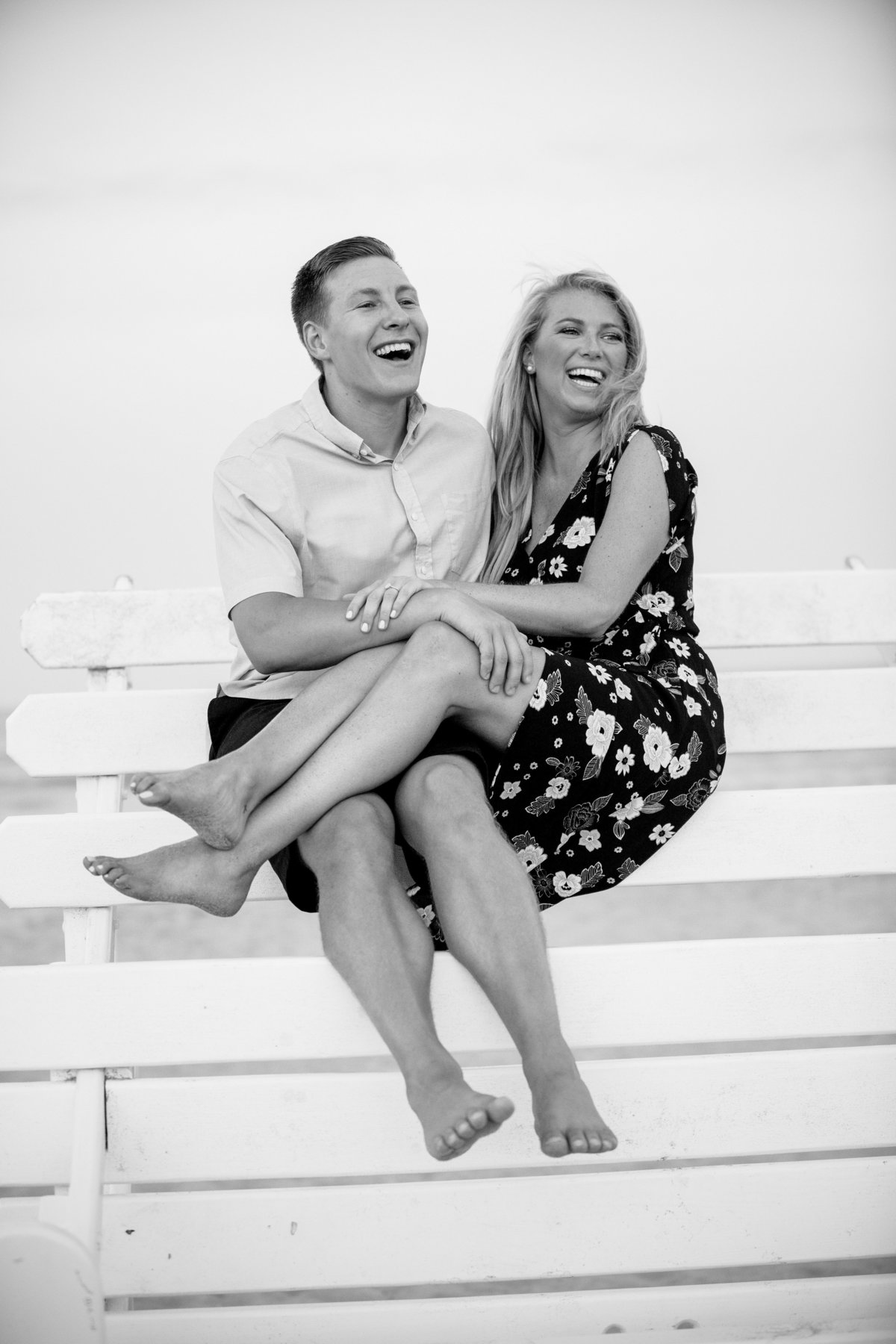 engaged couple on lifeguard stand at manasquan beach
