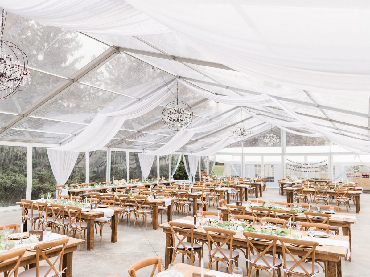Pine and pond wedding venue with tables and chairs