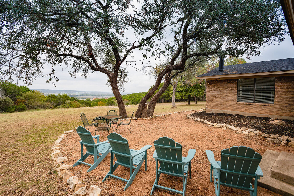 Outdoor seating area with stunning view at this three-bedroom, two-bathroom ranch house for 7 with incredible hiking, wildlife and views.