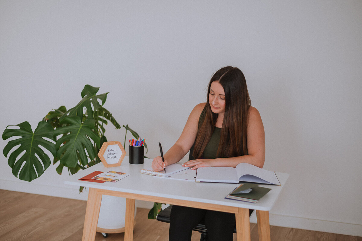 Creative business woman  working at desk in studio space
