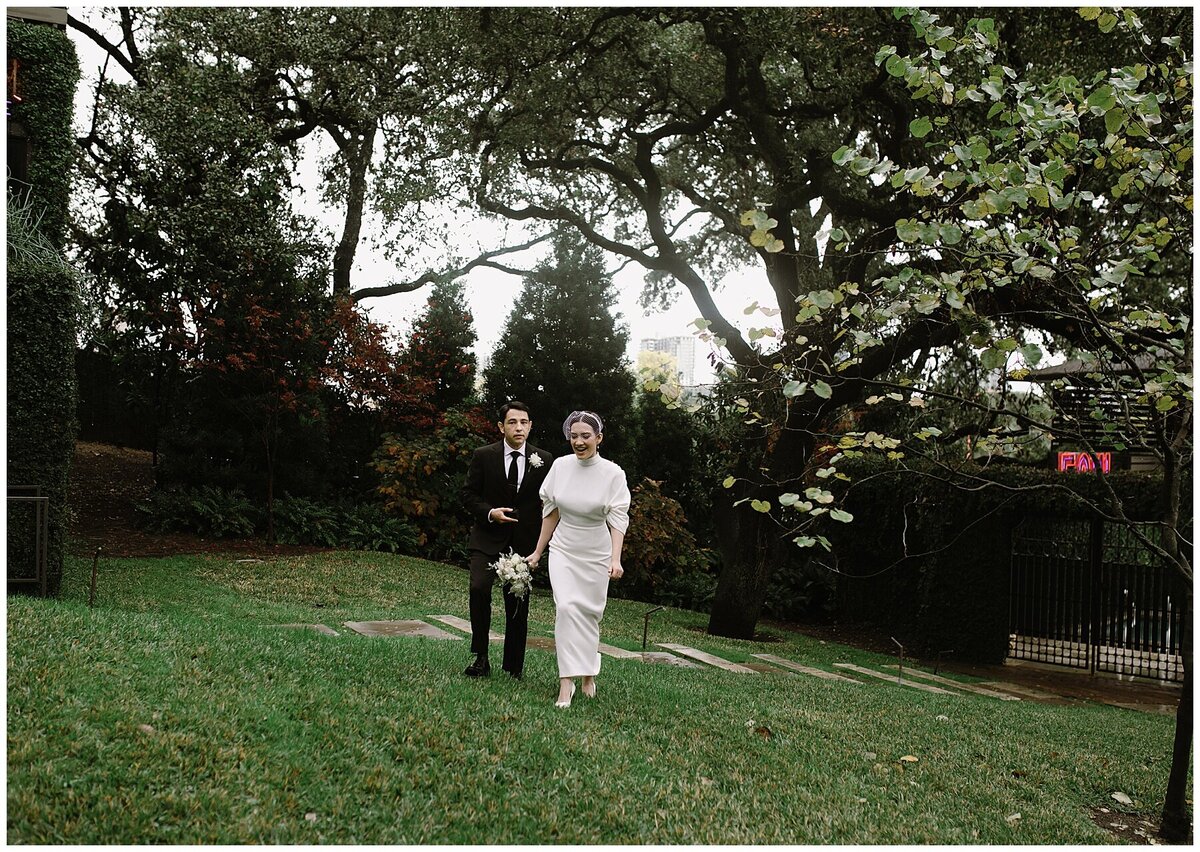 Bride and groom in the grounds of Hotel Cecilia Austin