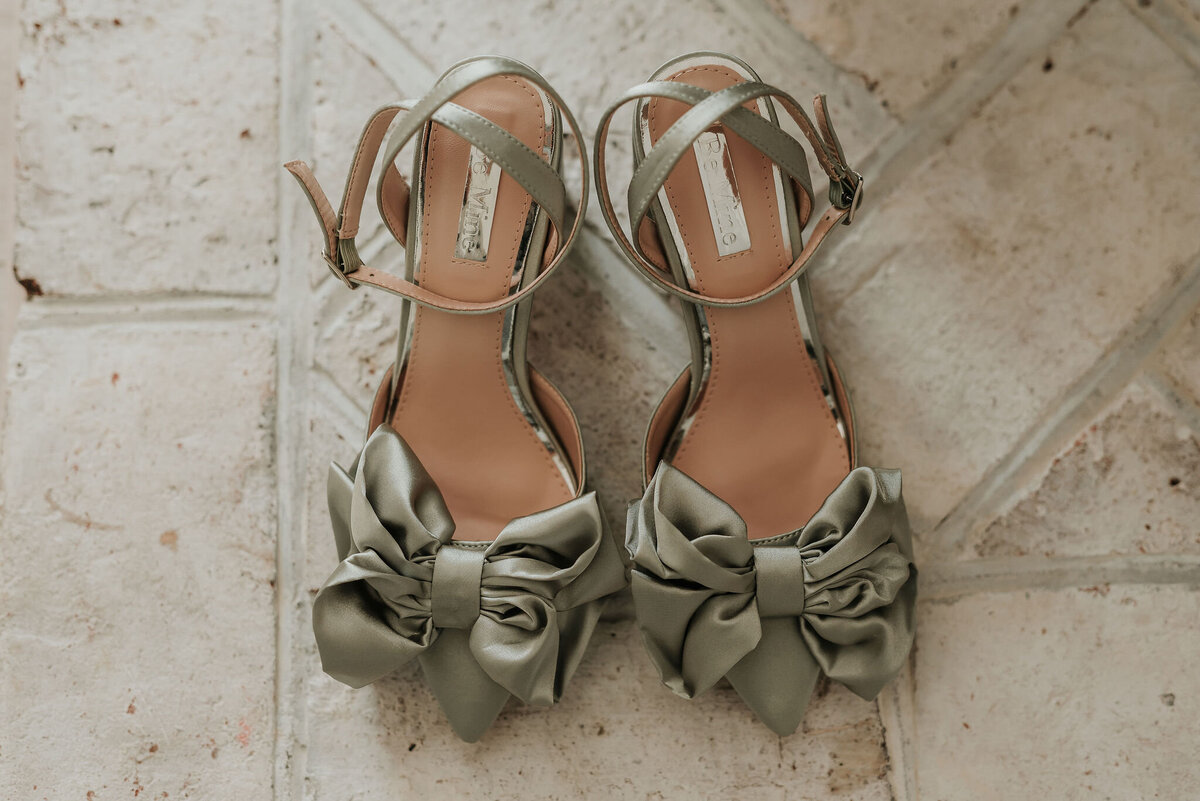 Stunning sage green satin bridal shoes with a beautiful bow