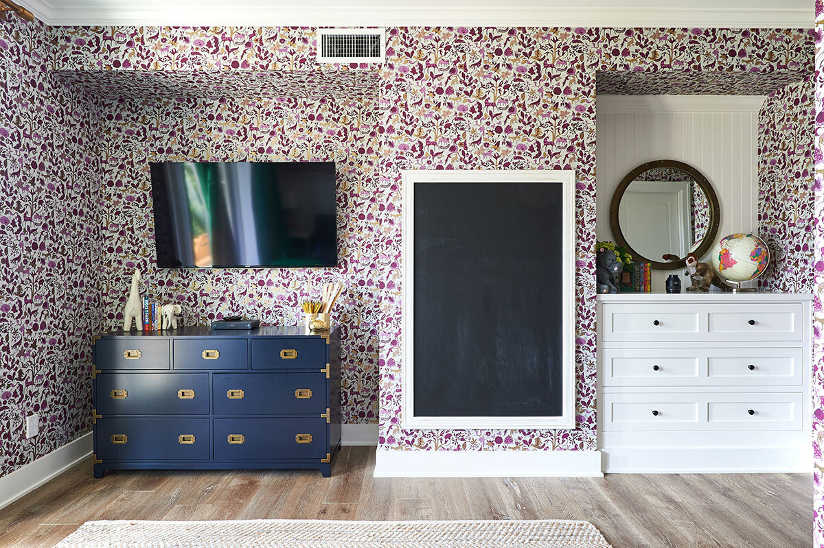 playroom with wallpaper and chalk board