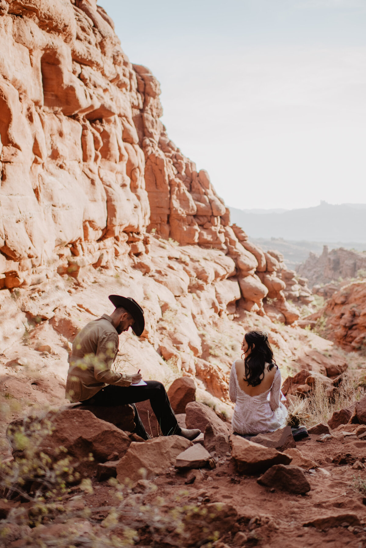 Utah Elopement Photographer captures bride and groom sitting together
