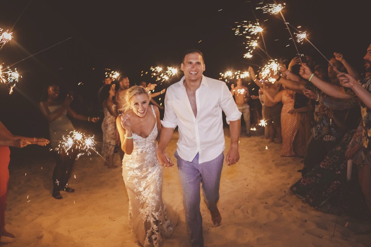 Bride and grooms sparkler exit at wedding in Cancun