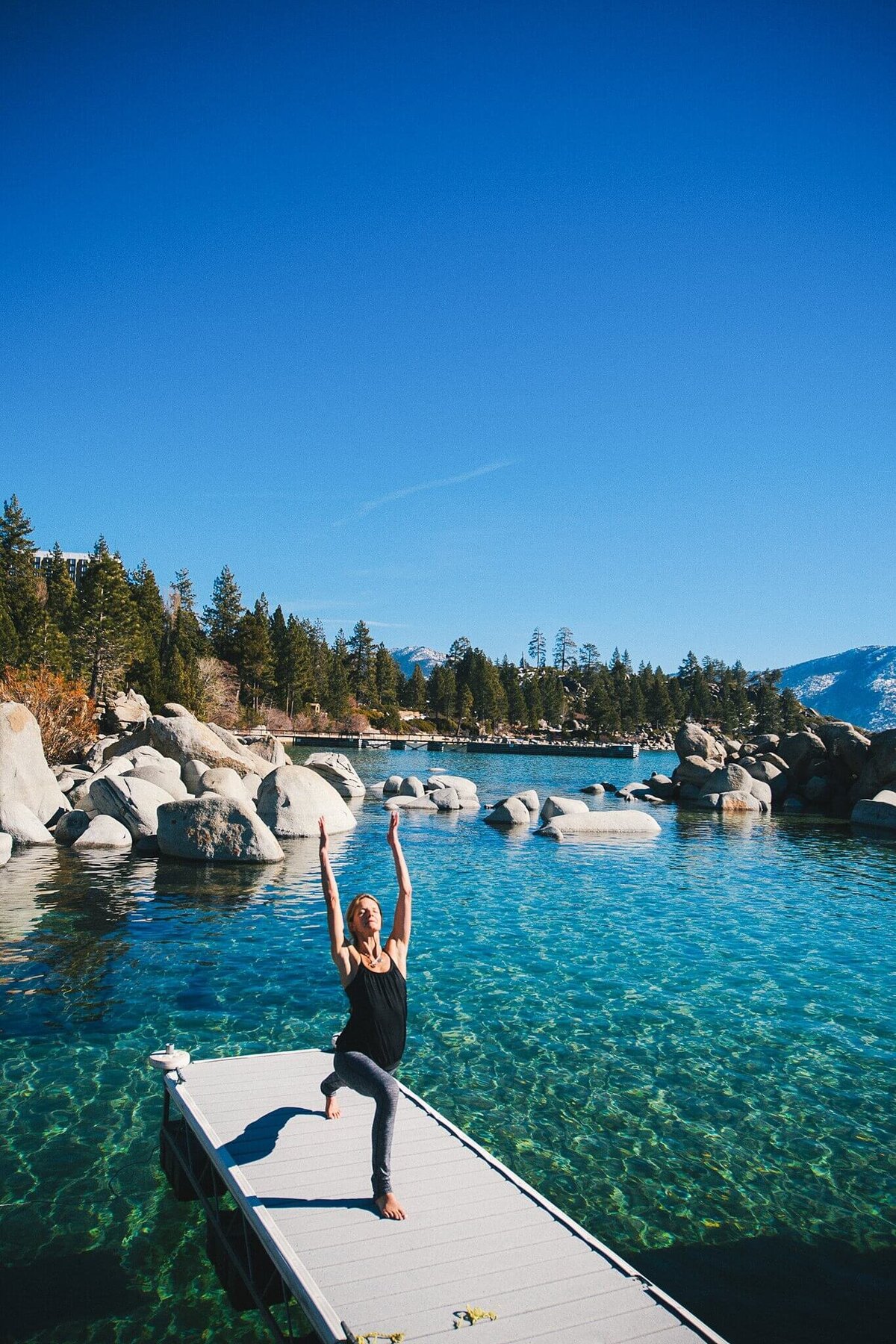 headshot session lake tahoe yoga pose on pier in middle lake tahoe