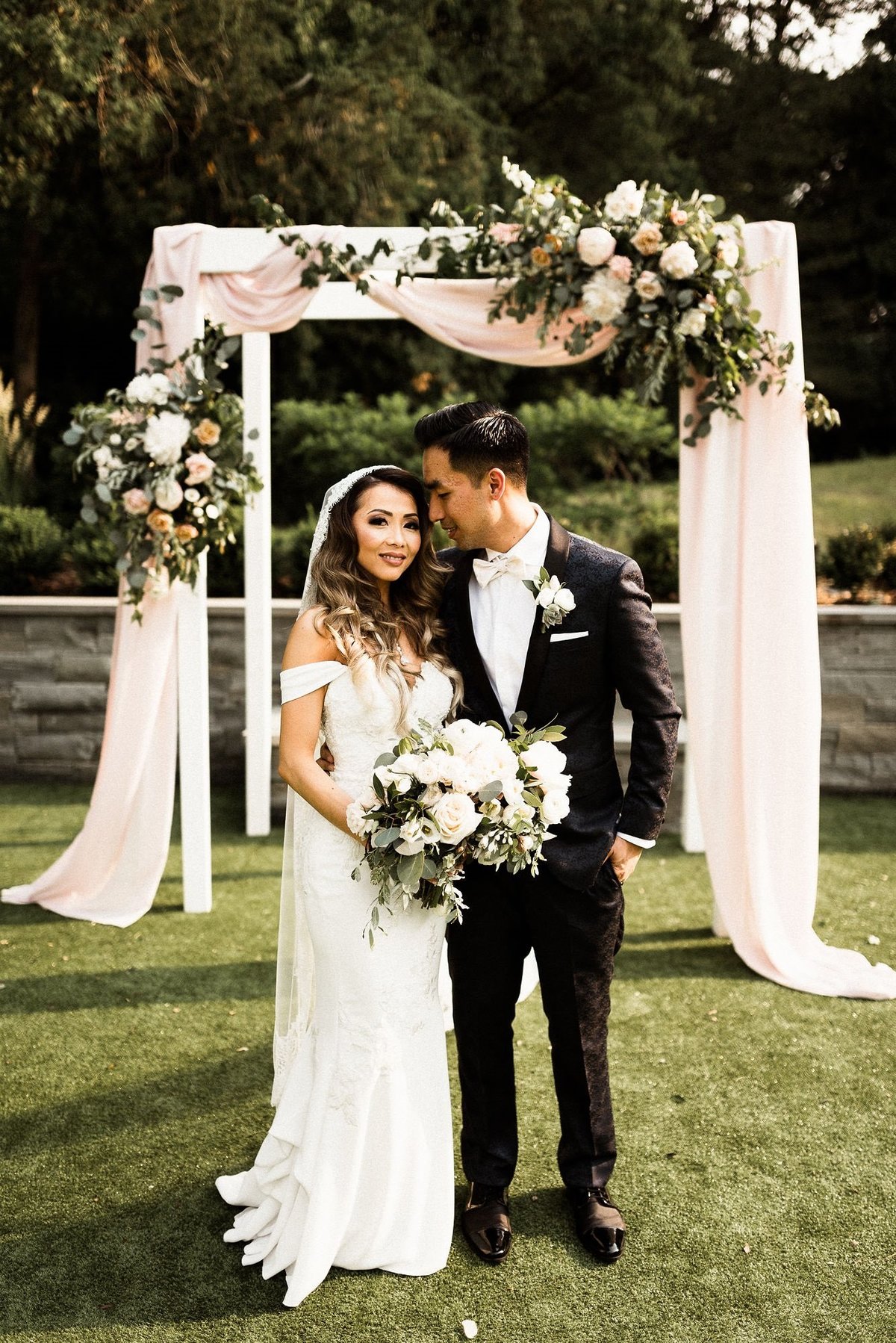 blush wedding arch flowers