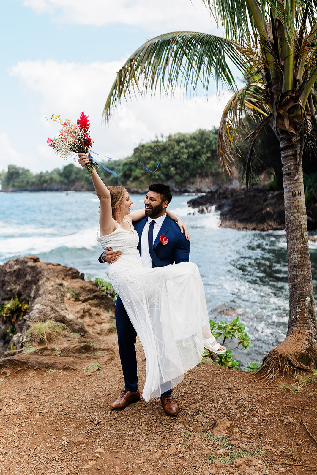 Hawaii Elopement Groom Carries Bride
