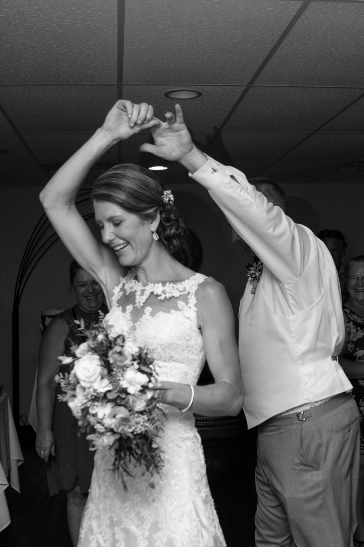 picture showing spin dance with bouquet and front of dress