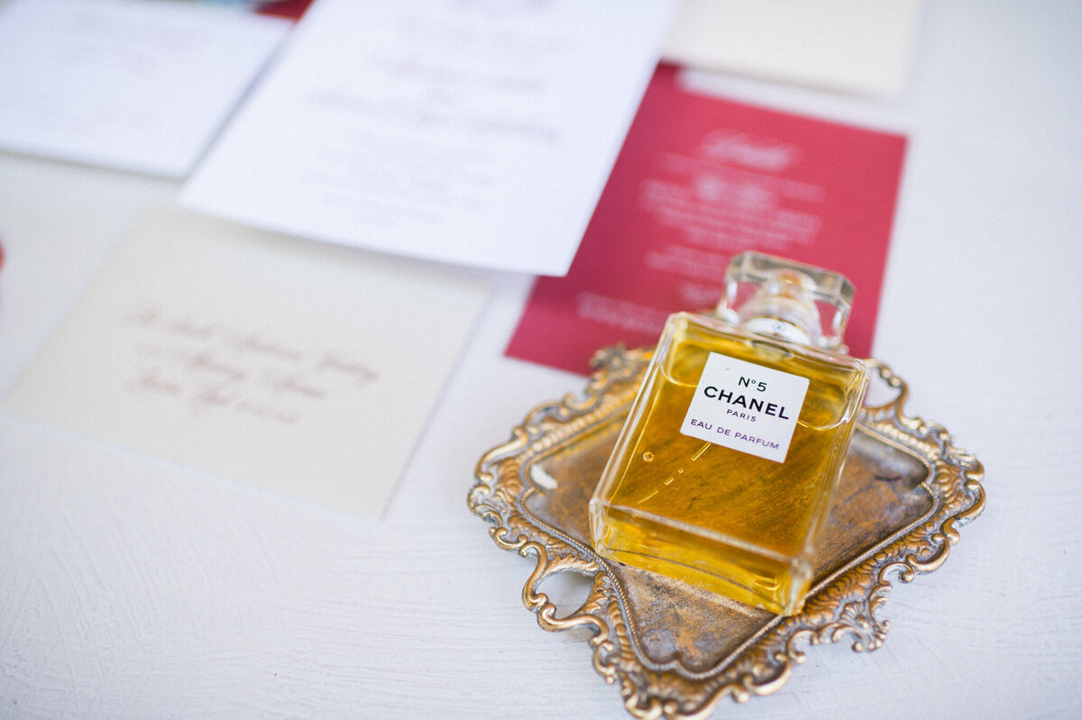 photograph of wedding invitation and chanel no 5 perfume