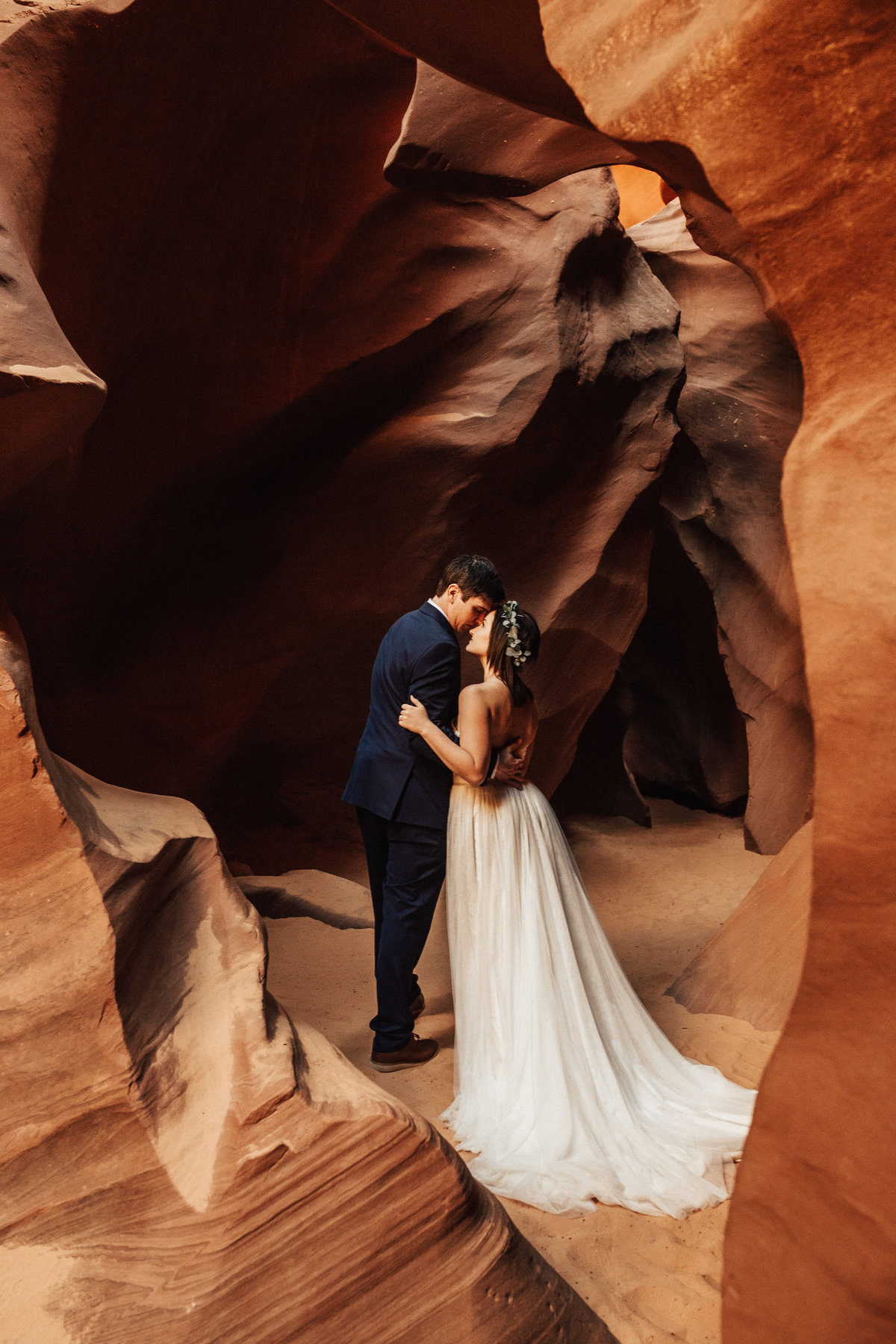 couple kissing in canyon