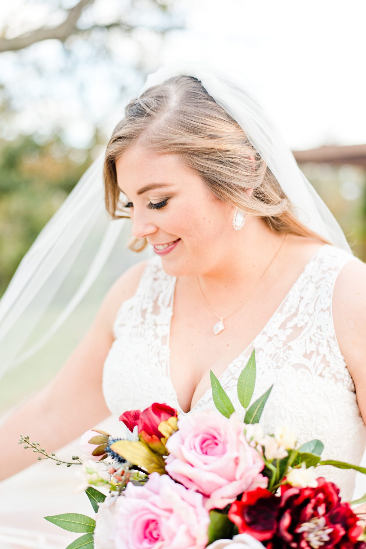 Close up photo of bride with colorful bouquet
