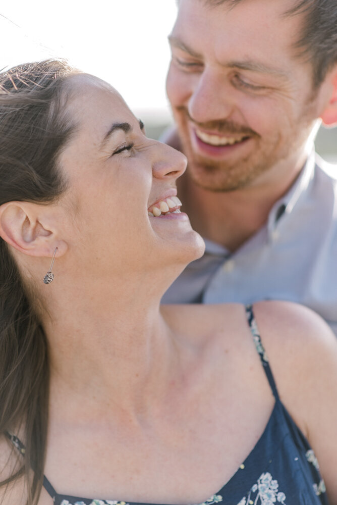 close shot of engaged couple laughing