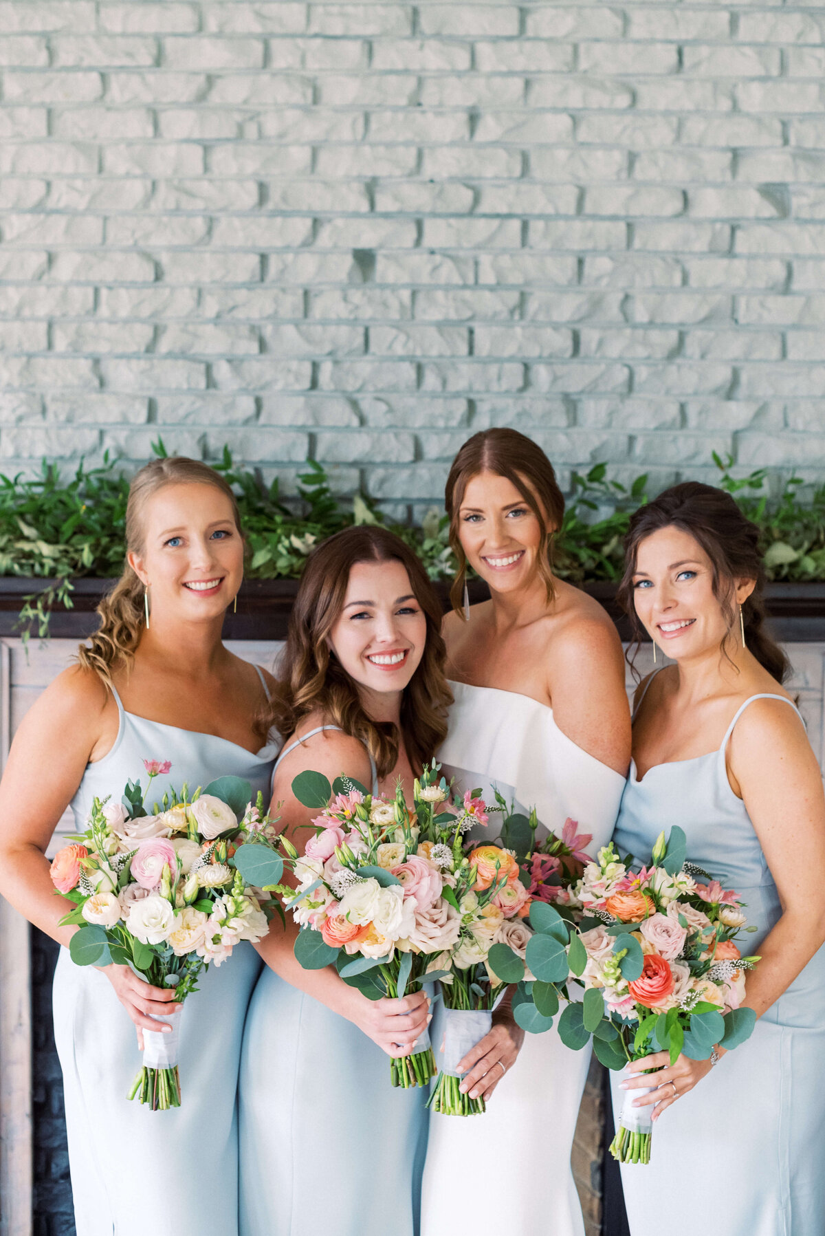 Bride with bridesmaids in pale blue at Oceanstone Resort Wedding in Nova Scotia