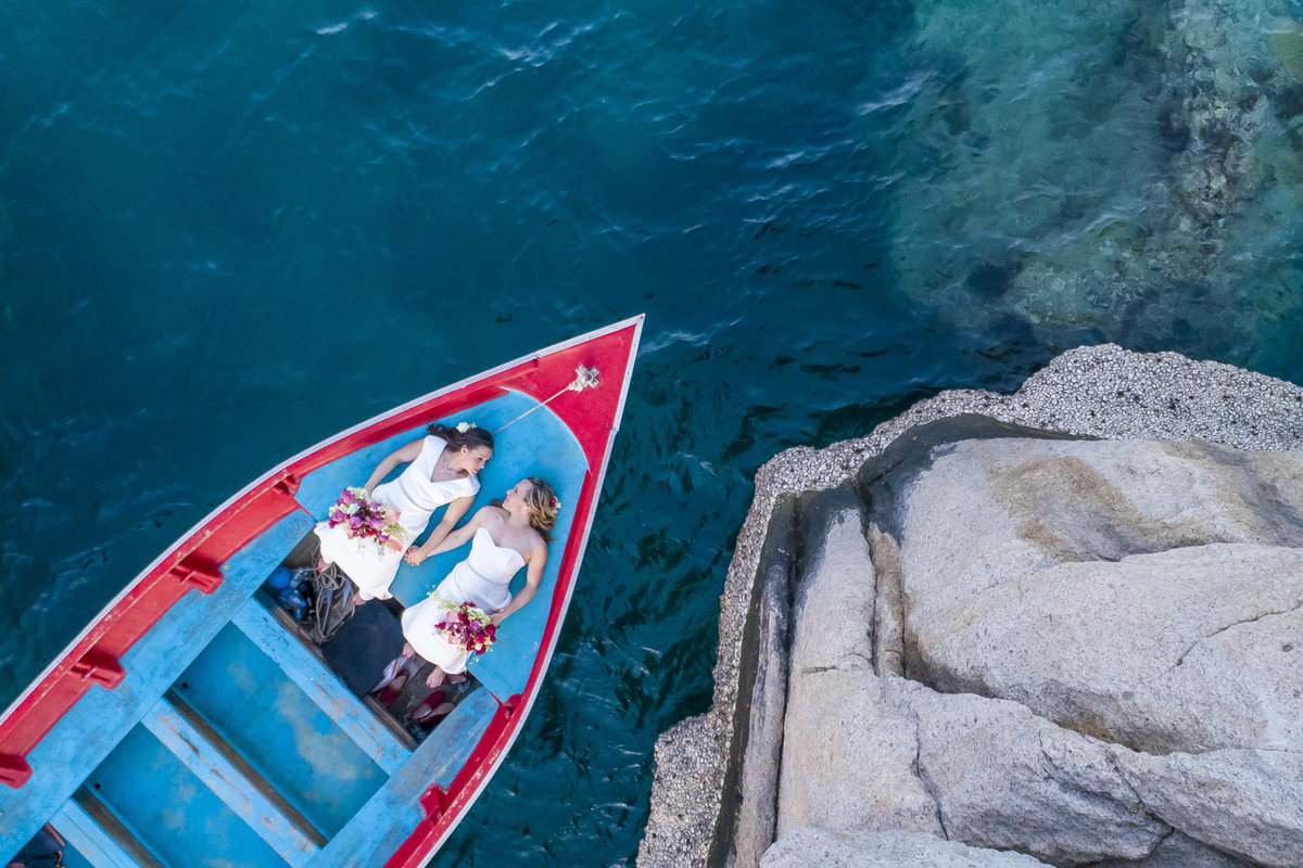 Two brides on a longtail boat in Koh Tao, Thailand