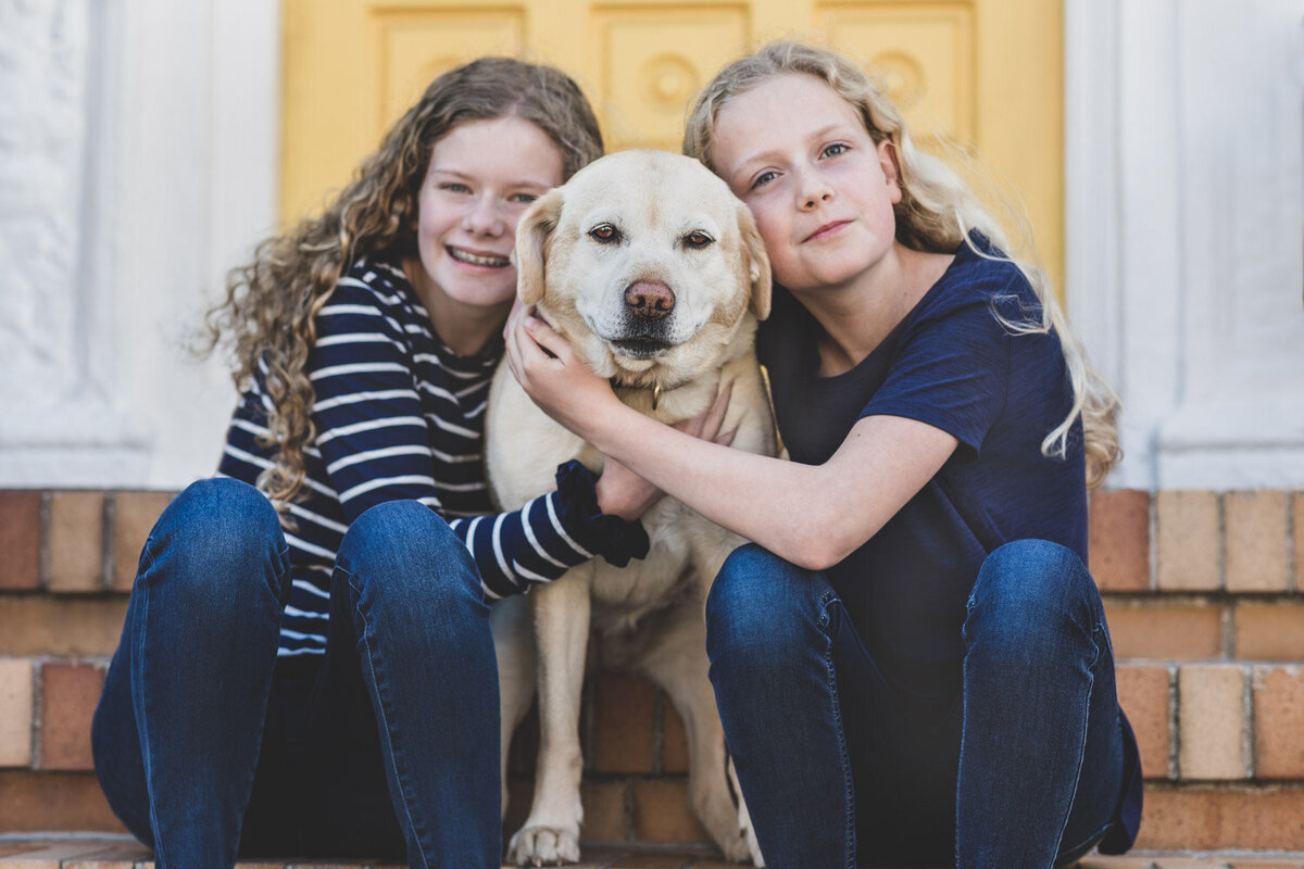 sisters with dog