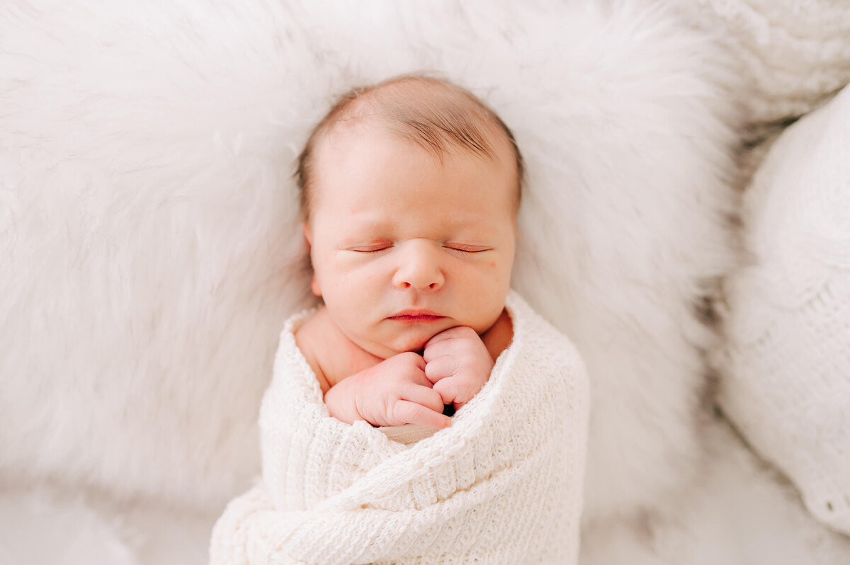 newborn swaddled and sleeping during Springfield MO newborn photography session
