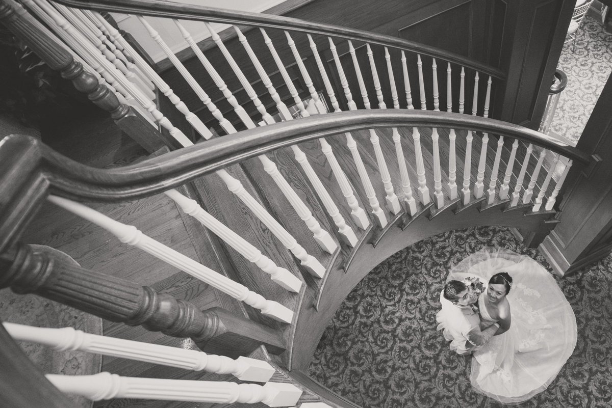 Bride and groom portrait at the staircase of Bridgeview Yacht Club
