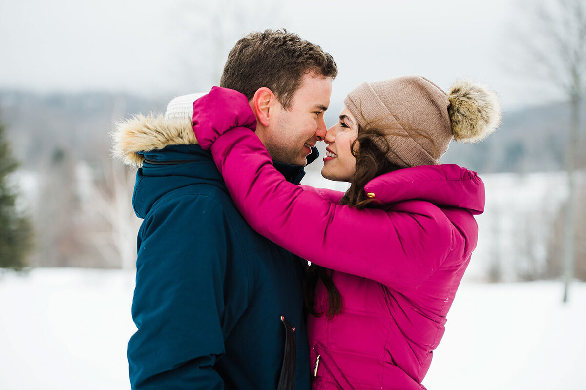 engaged couple bright pink coat winter stratton vermont