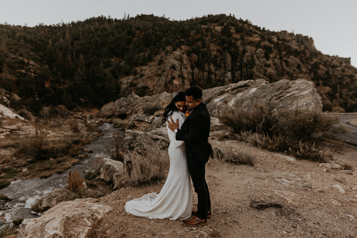 bride and groom holding each other in Jemez Springs