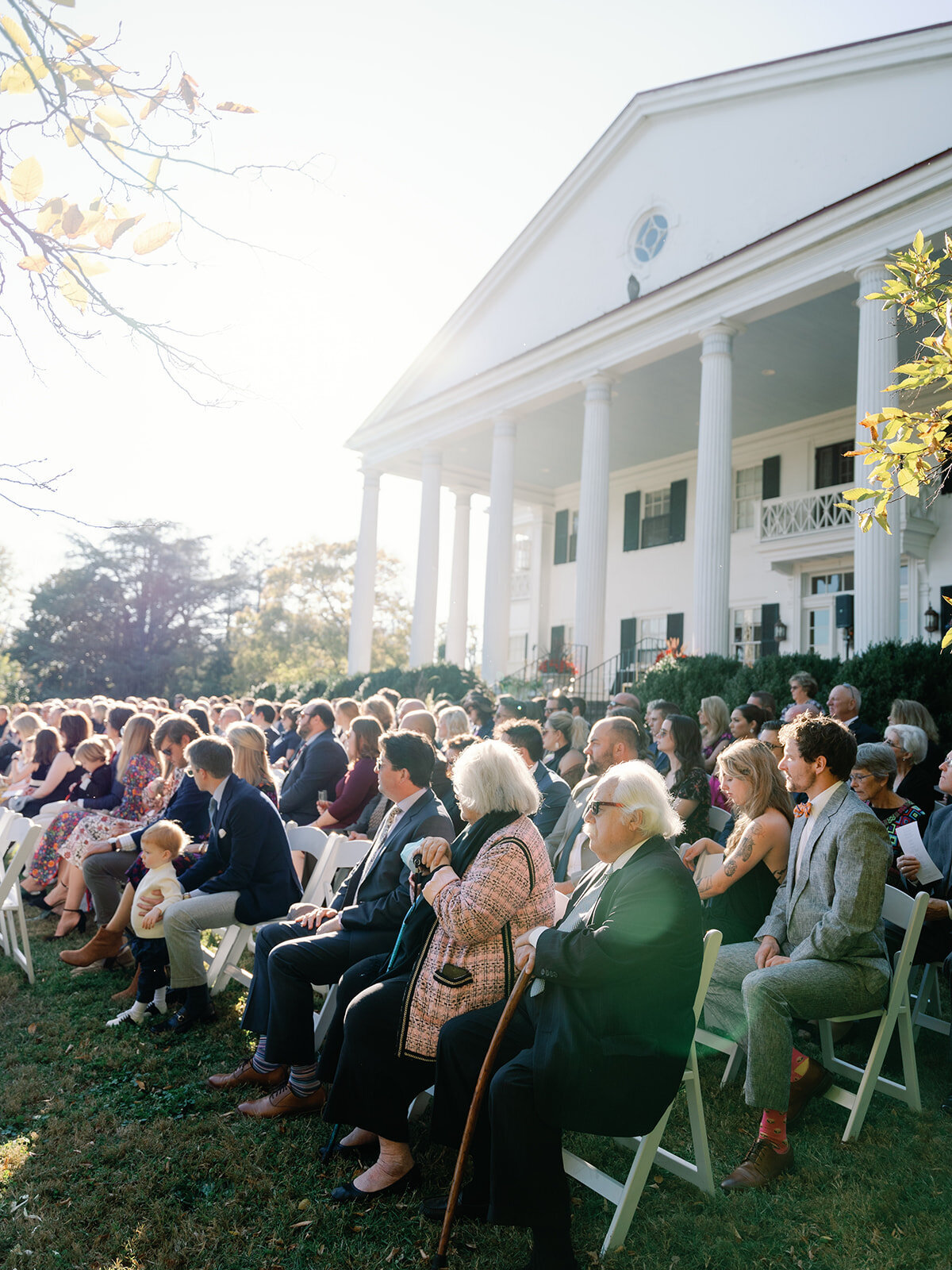 Wedding ceremony with guests on lawn of rosemont manor