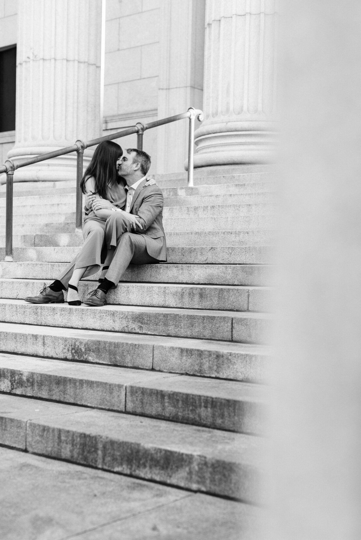 couple kissing on steps of the MIA