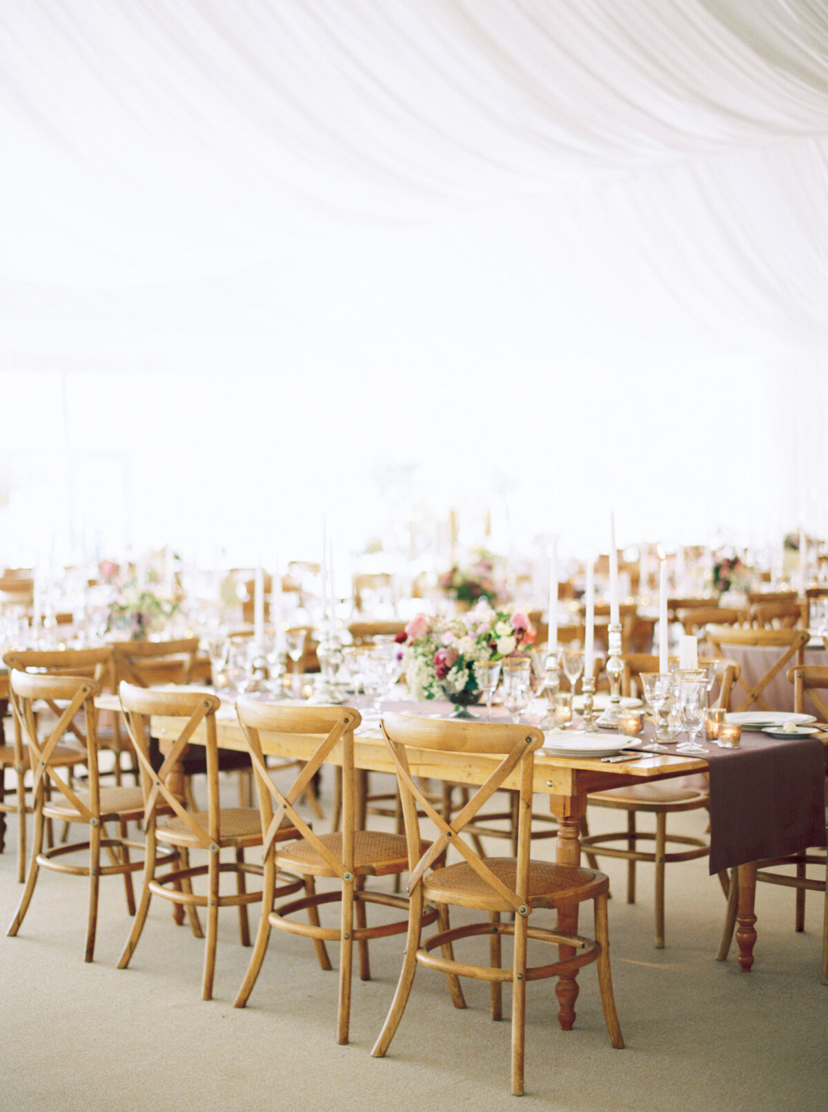 tented-outdoor-wedding-long-tables-wood-chairs