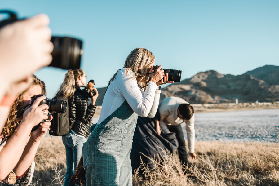 women taking photos at a retreat