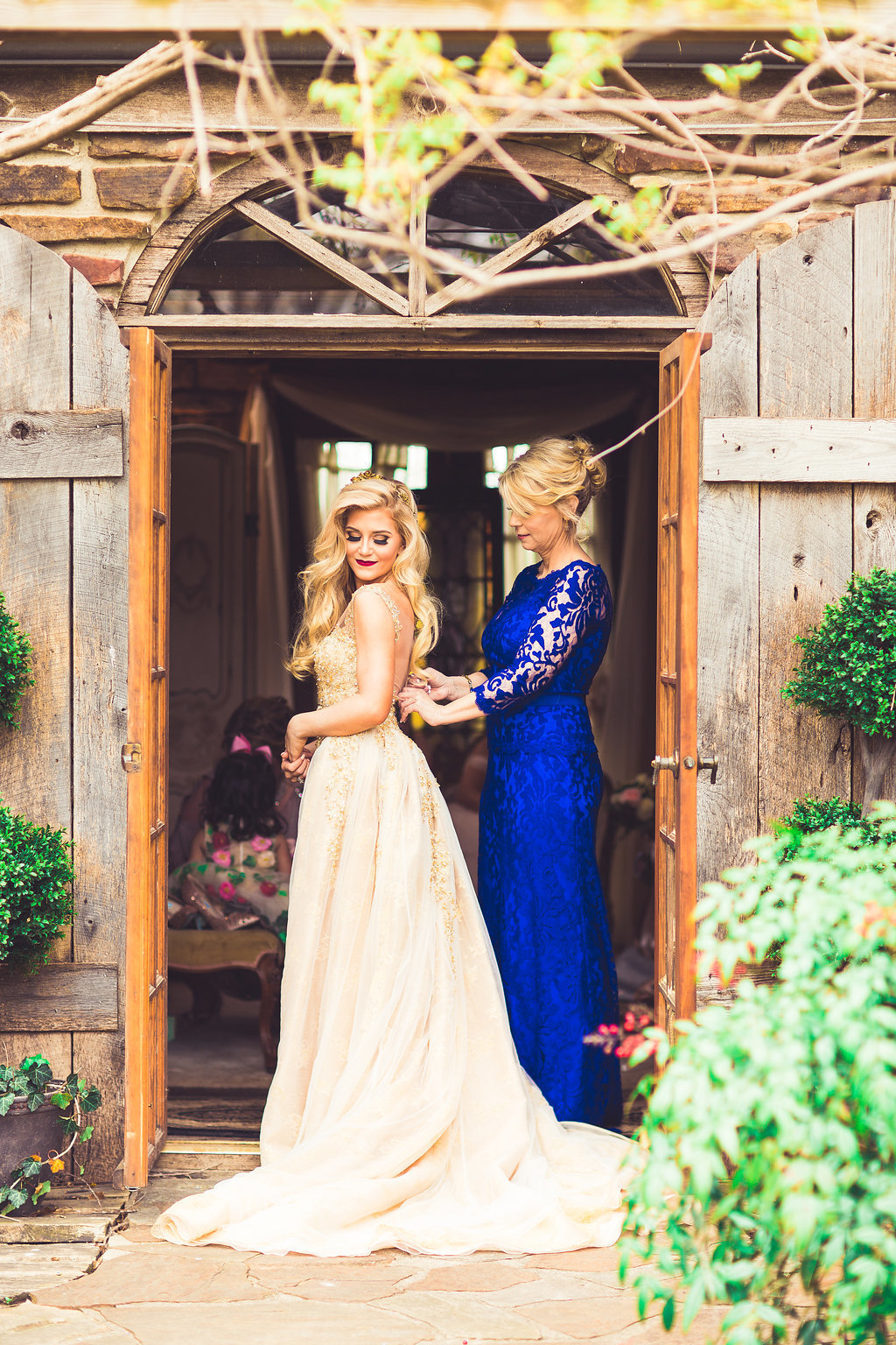 Wedding Photograph Of Bride and Maid of Honor in Blue Dress Los Angeles